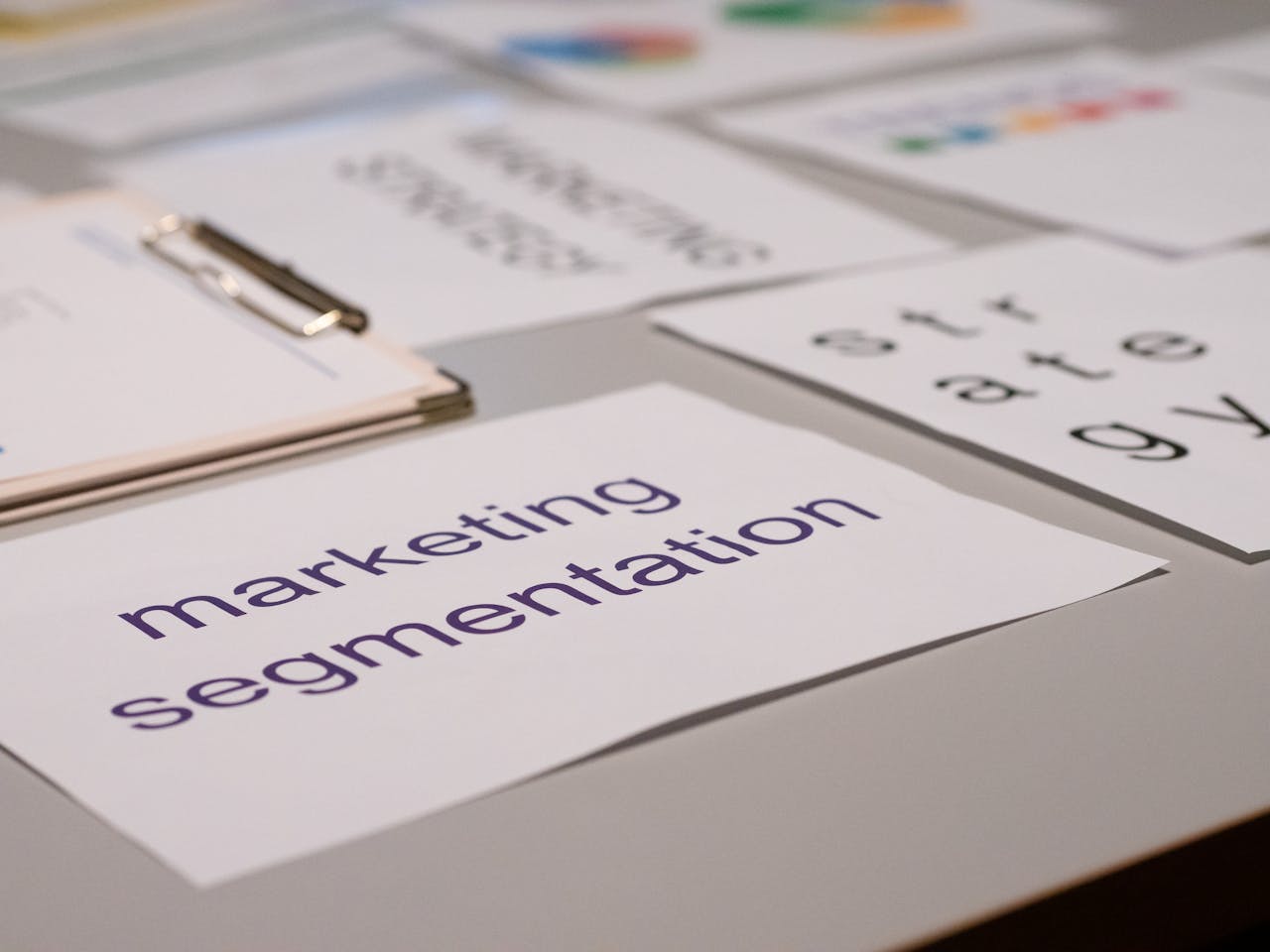 services-01 Close-up of various marketing documents on a desk, perfect for business and strategy discussions.